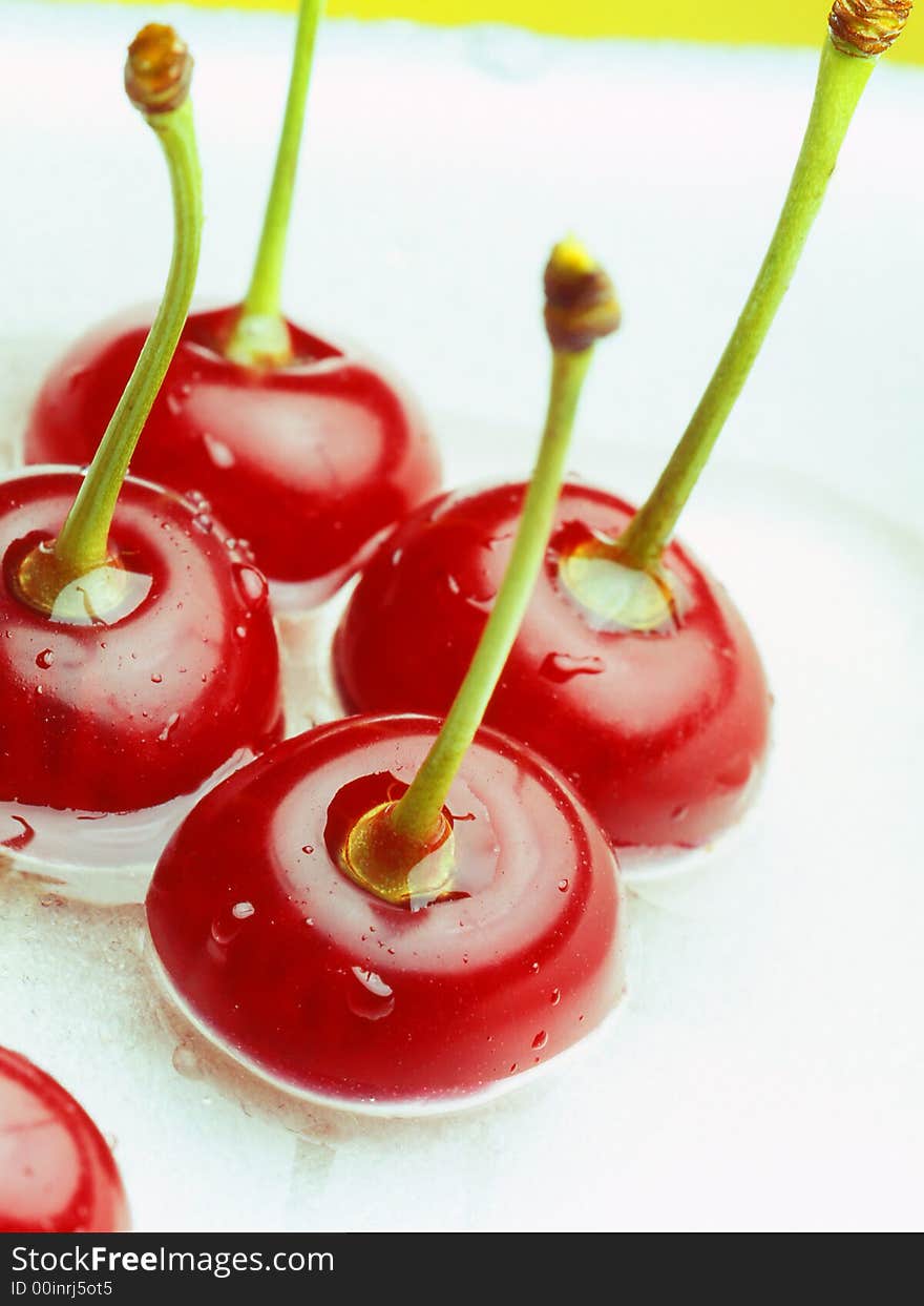 Red cherry laying on a white background