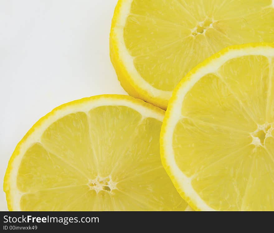 Slices of lemon isolated on white background