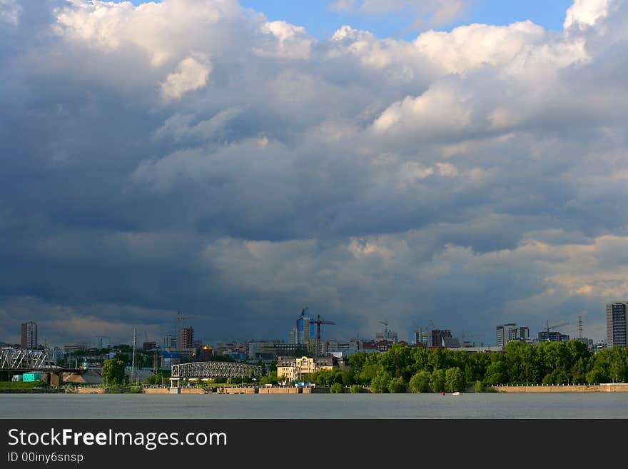 Cityscape before thunderstorm with dramatic and contrasts clouds. Cityscape before thunderstorm with dramatic and contrasts clouds