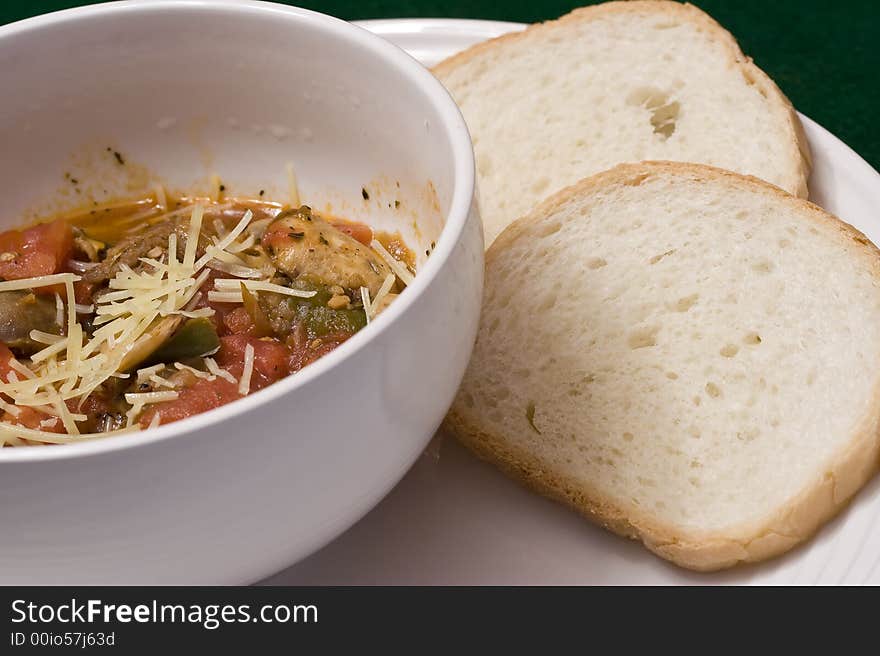 Serving of penne spaghetti white dishes nice reddish colors. Serving of penne spaghetti white dishes nice reddish colors