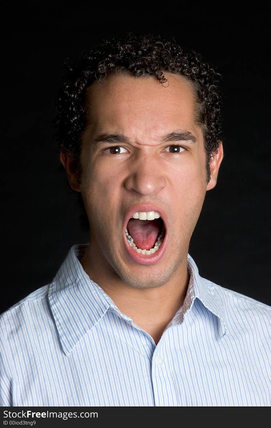 Angry isolated young man yelling. Angry isolated young man yelling