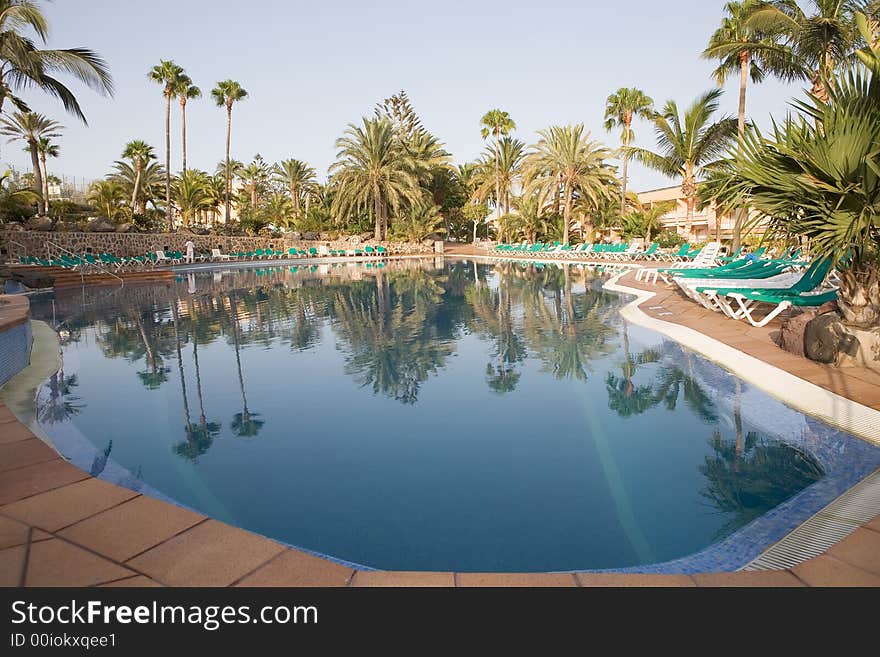 A beautiful pool and sun loungers. A beautiful pool and sun loungers