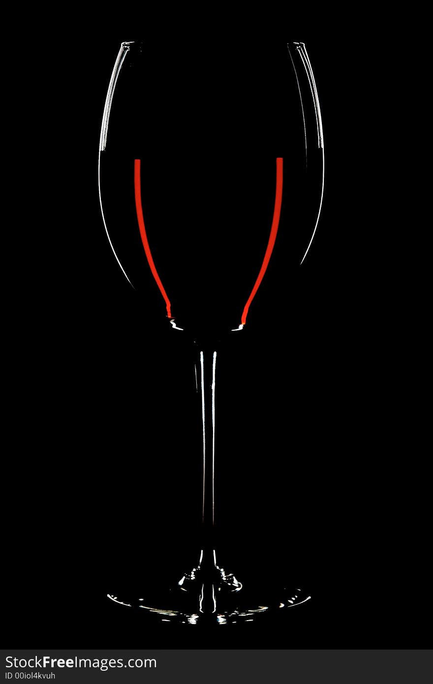 Glass with red wines on the black background