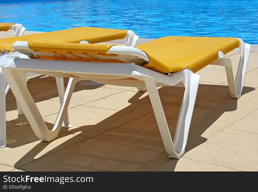 Pool sunbeds closeup