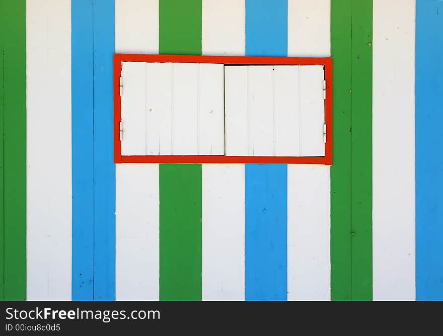 Blue and green wooden stripes texture with a window