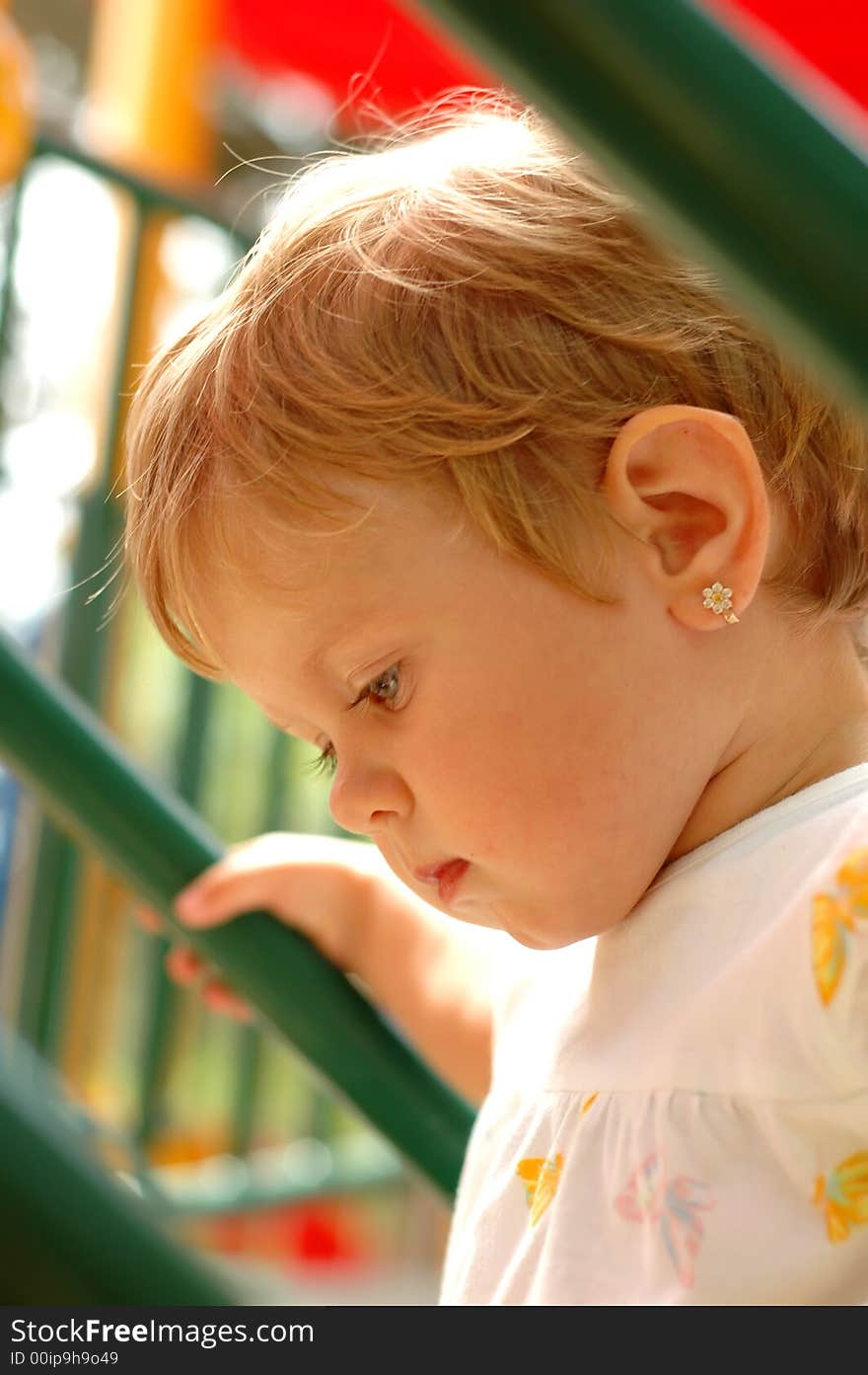 Fun girl at outdoors playground