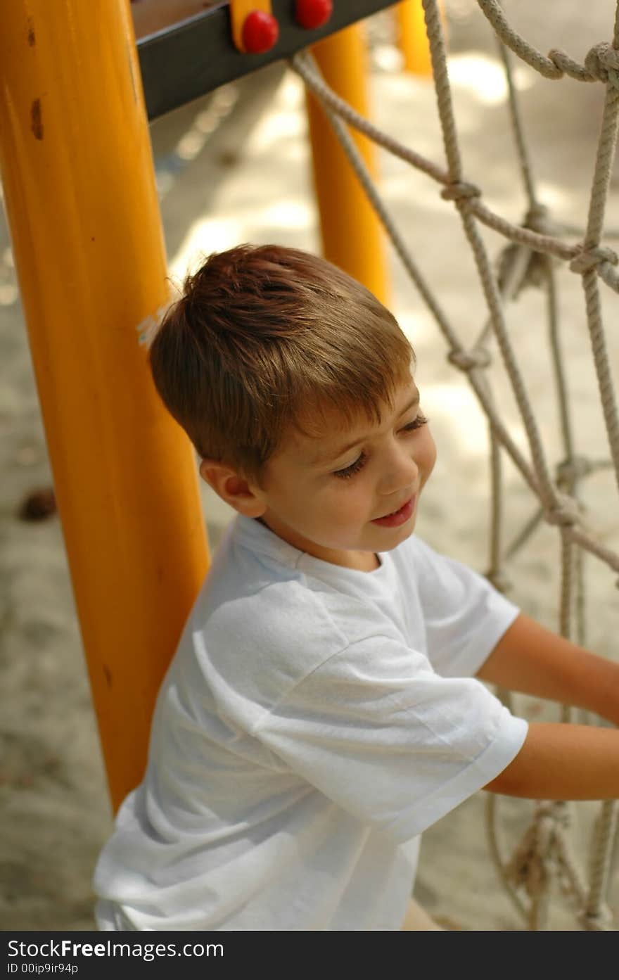 Handsome boy at outdoors playground