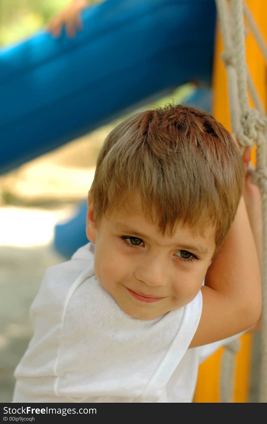 Handsome boy at outdoors playground