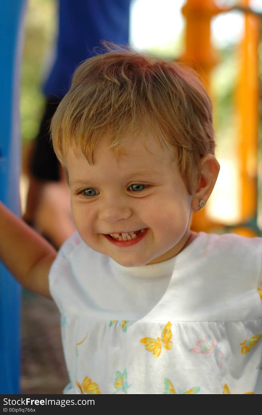 Fun girl at outdoors playground