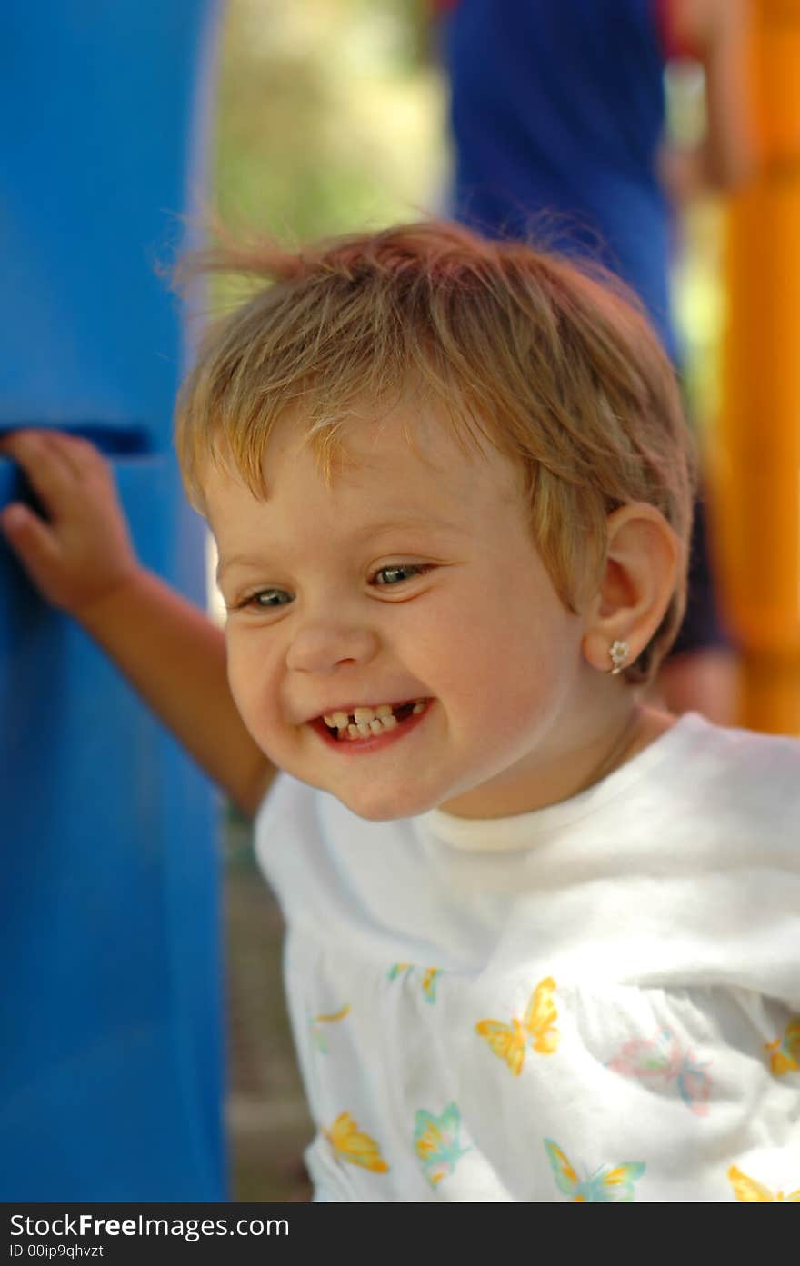 Fun girl at outdoors playground