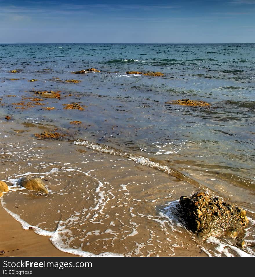 Surf. A surf at rocky coast of ocean