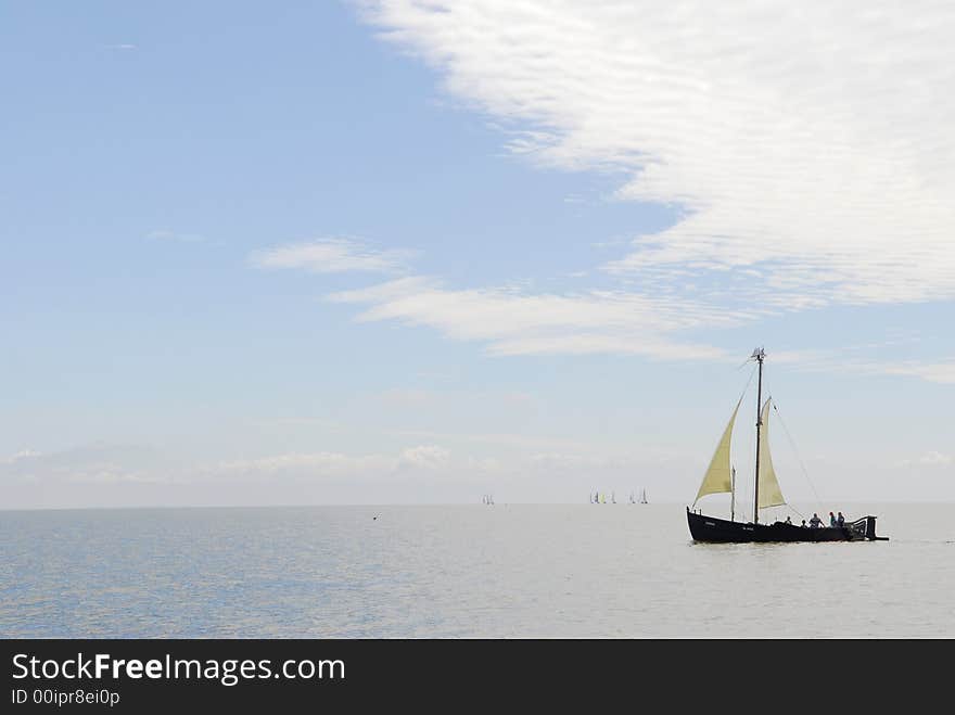 Old ship sails in sea