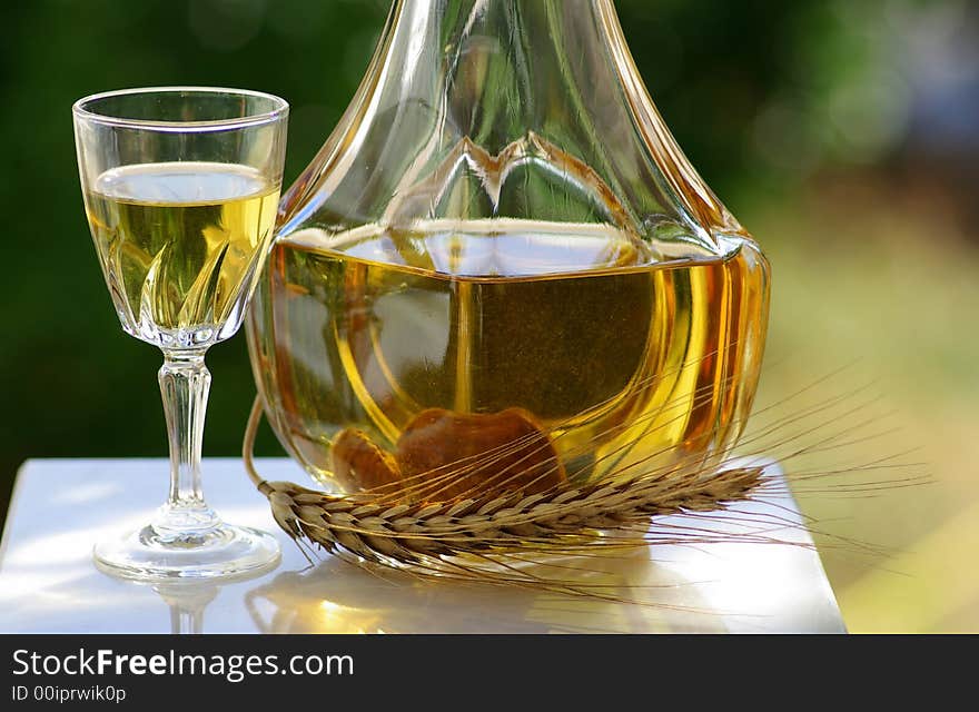 Bottle and glass with burning hot water of fig.