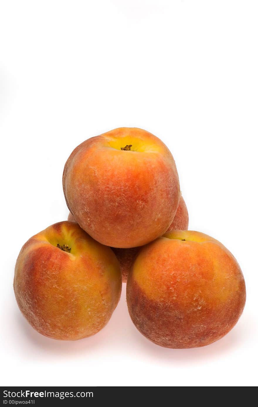 Stack of peaches on white