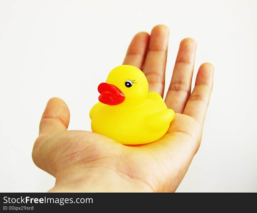 A mini rubber ducky resting in my hand. A mini rubber ducky resting in my hand.