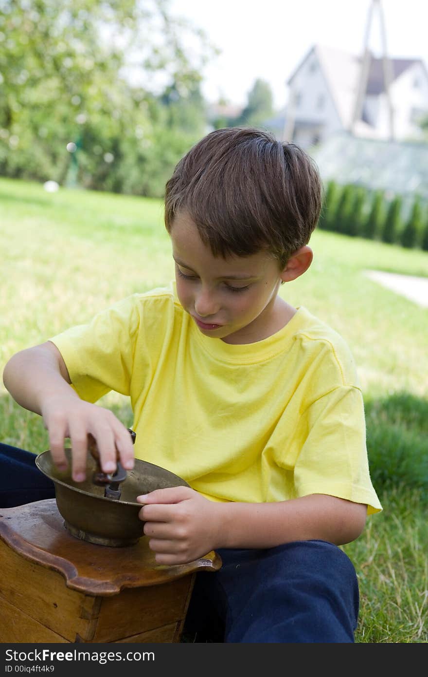 Boy and coffee mill