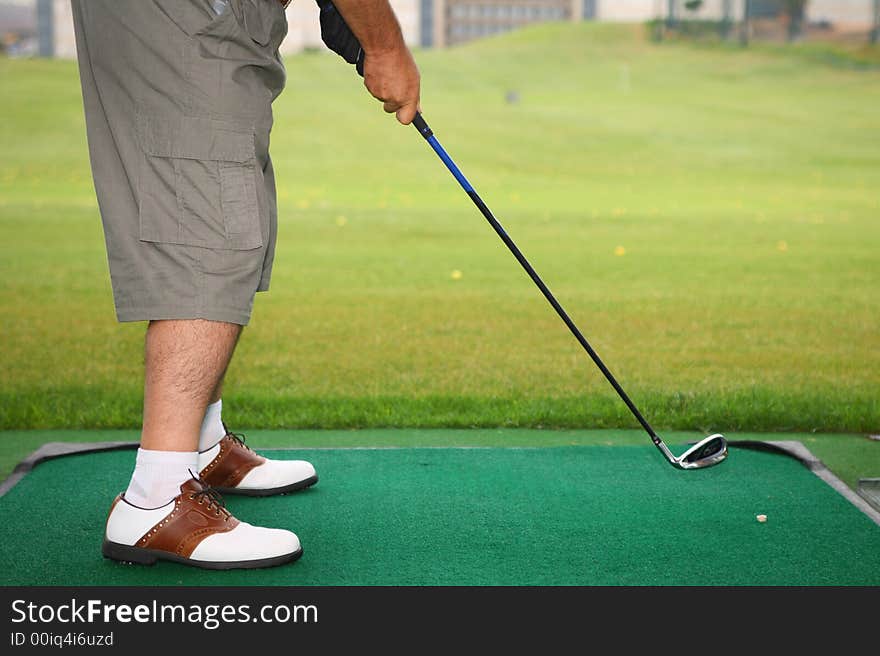 Senior golfer play golf in the city golf school field. Senior golfer play golf in the city golf school field