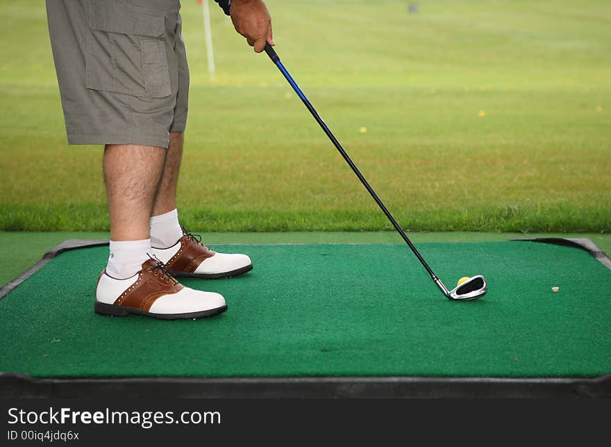 Senior golfer play golf in the city golf school field. Senior golfer play golf in the city golf school field