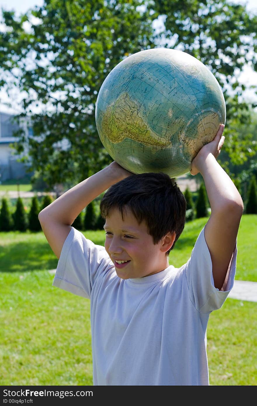 Brothers and globe on lawn