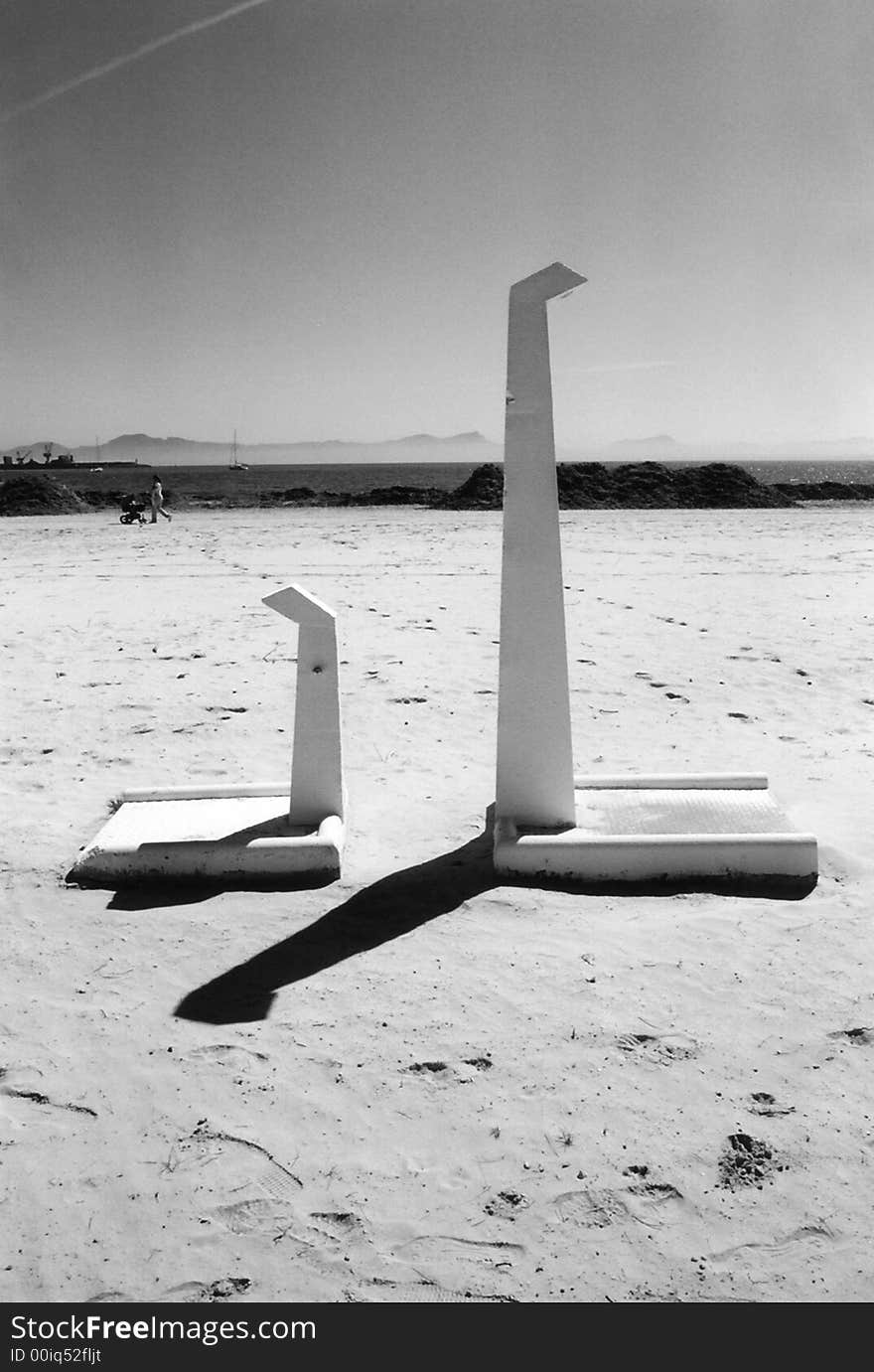 Large and small shower made of concrete at a beach in Alcudia, Majorca. Large and small shower made of concrete at a beach in Alcudia, Majorca