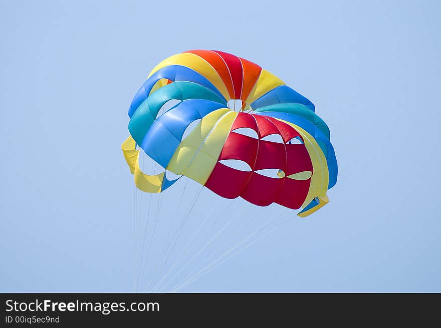 Macro of colorful parasailing parachute in the sky. Macro of colorful parasailing parachute in the sky