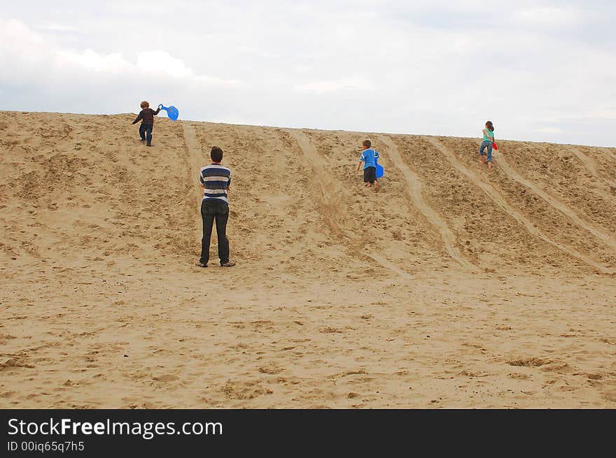 Family with children on dunes