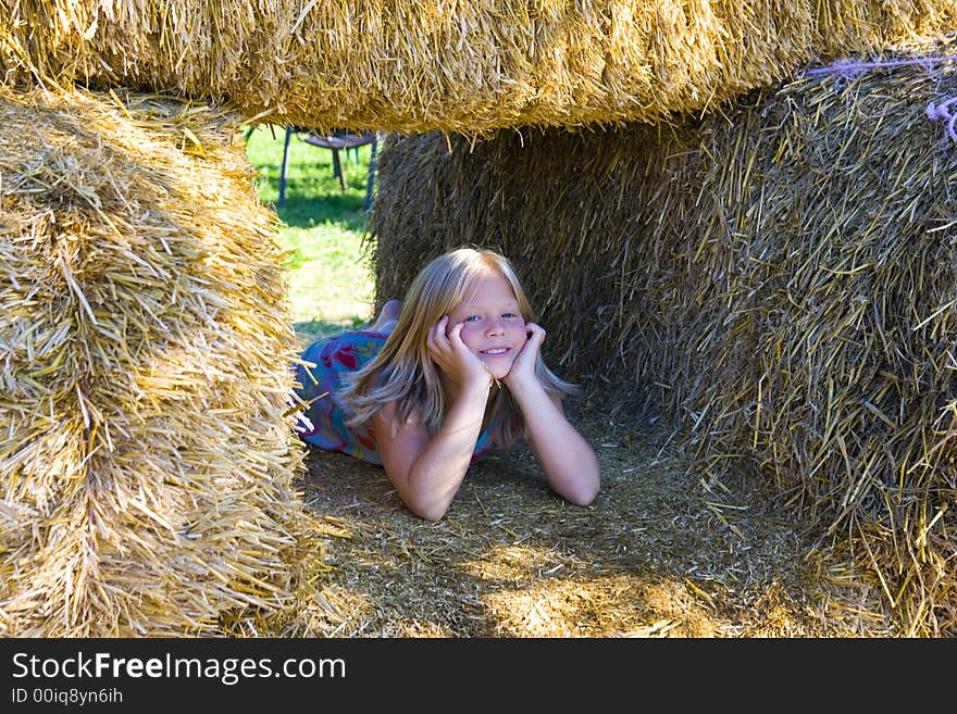 Cute Girl On Haybales