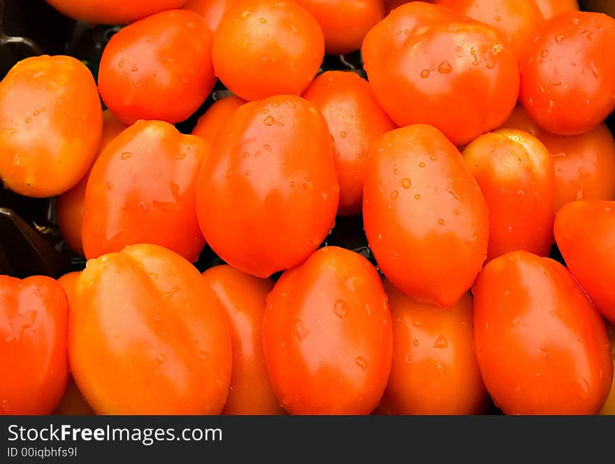 A bunch of red ripe tomatoes.