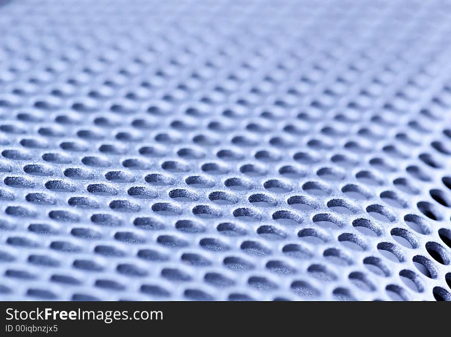 Blue toned perforated steel texture. Blue toned perforated steel texture