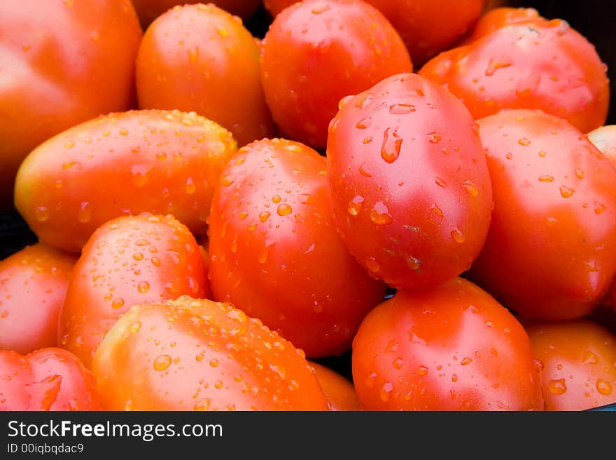 A bunch of red ripe tomatoes.