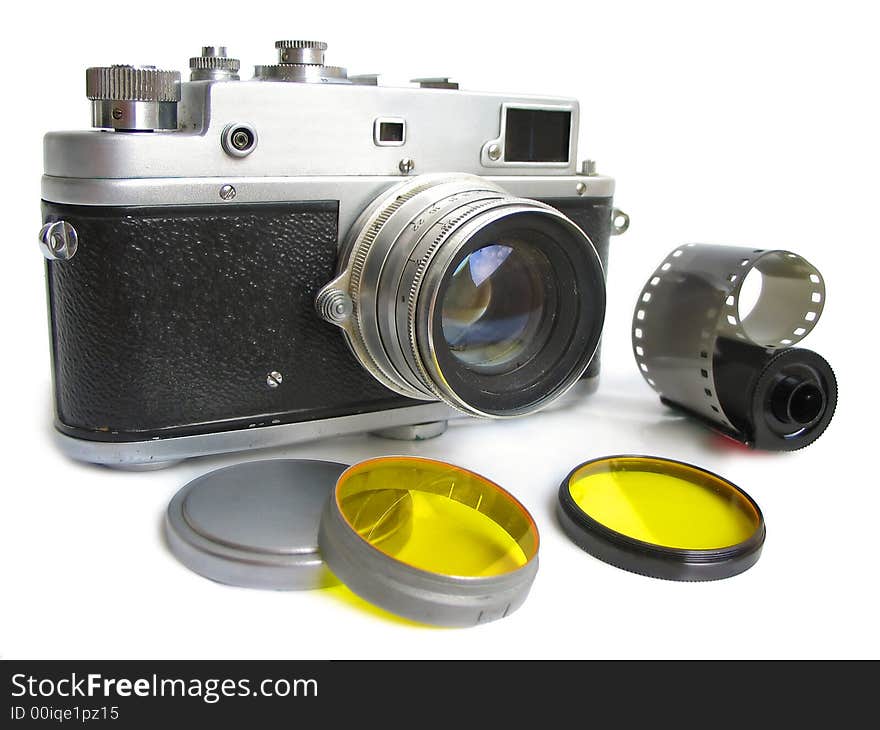 Isolated vintage camera with photofilters and negativ film on white background.