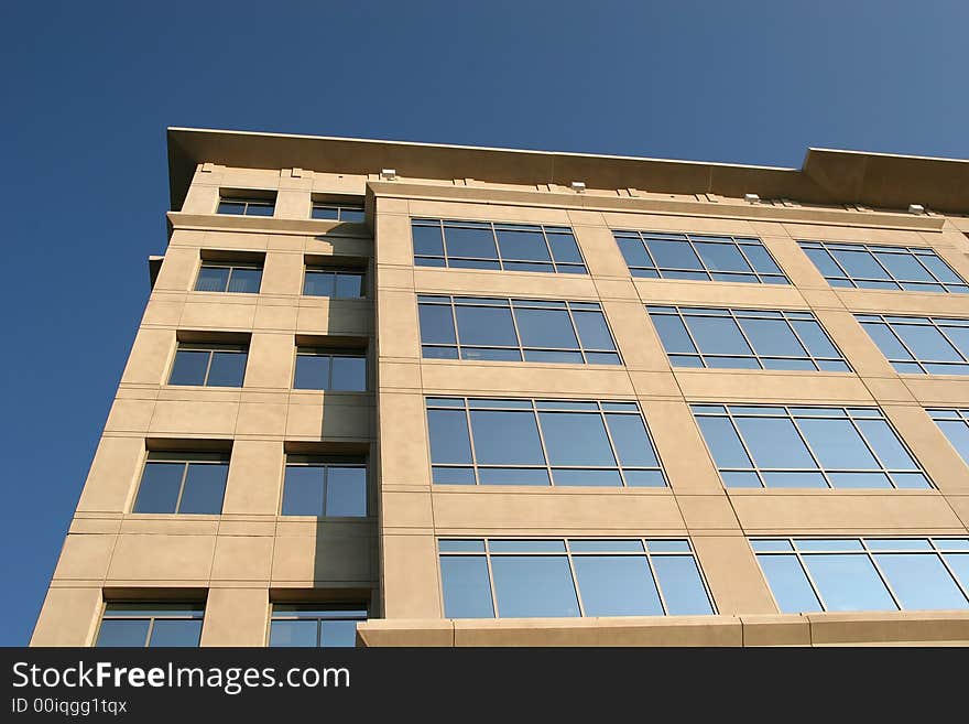 An office building facing the early morning sun light. An office building facing the early morning sun light