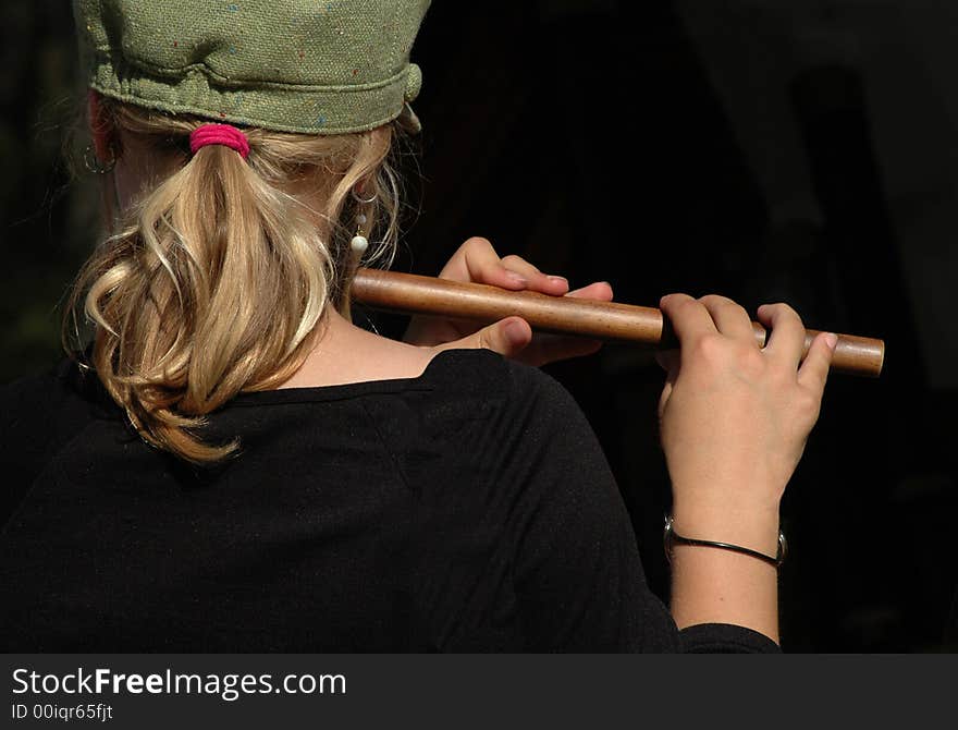 Young girl playing a recorder. Young girl playing a recorder