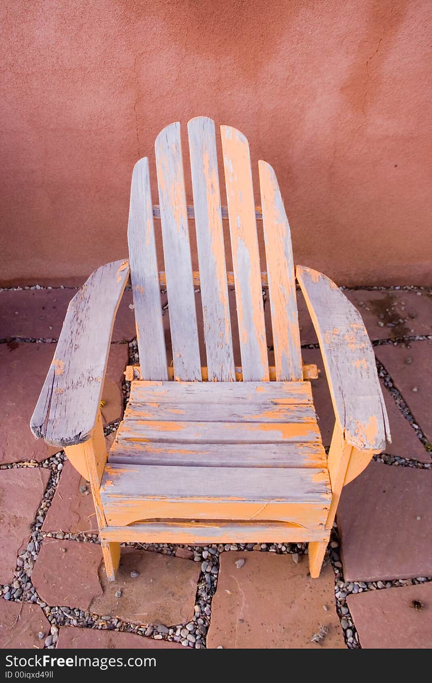 Old rustic chair with peeling yellow paint. Old rustic chair with peeling yellow paint