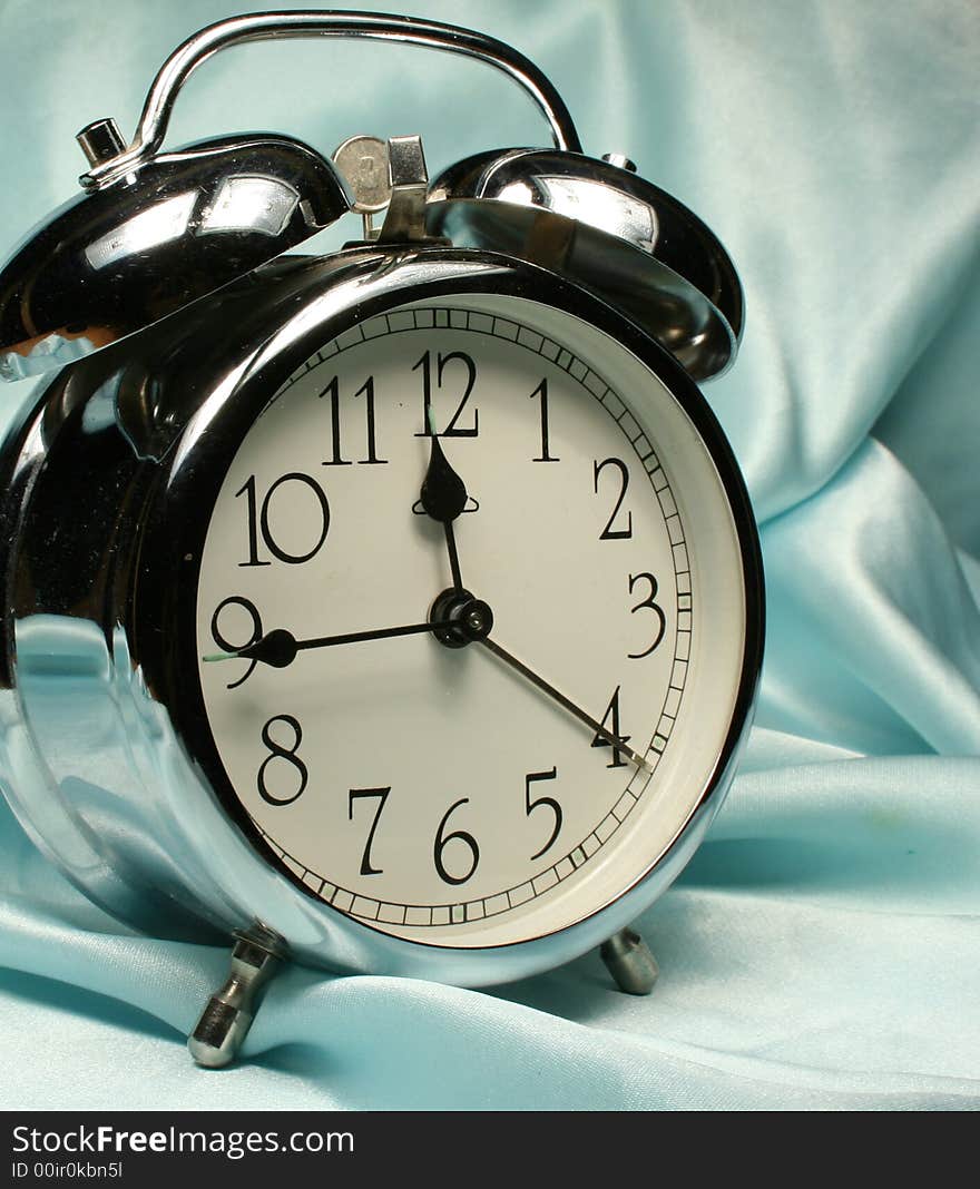 Alarm-clock on blue background