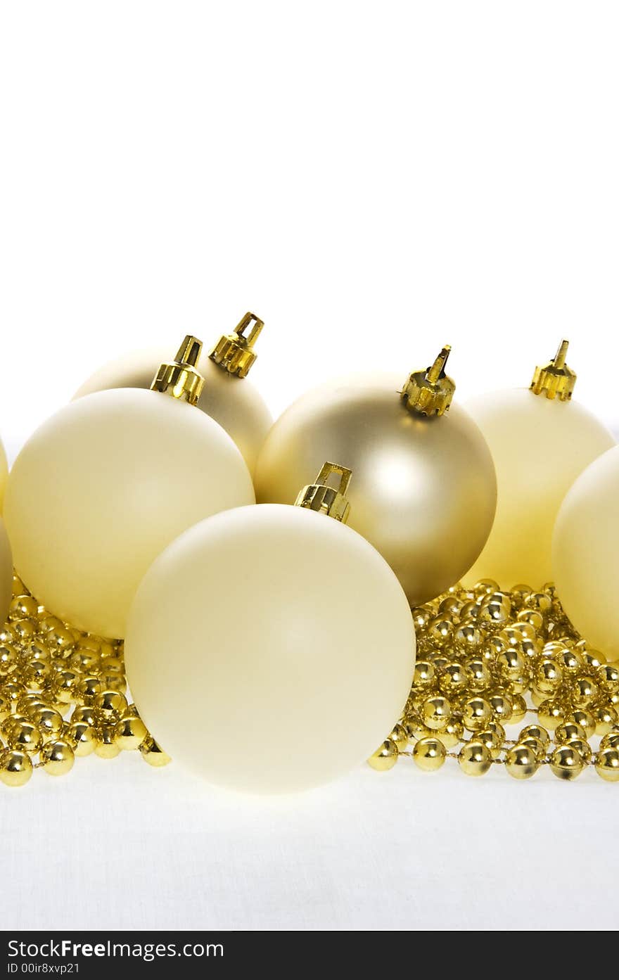 Complimentary golden & cream coloured christmas decorations. Complimentary golden & cream coloured christmas decorations