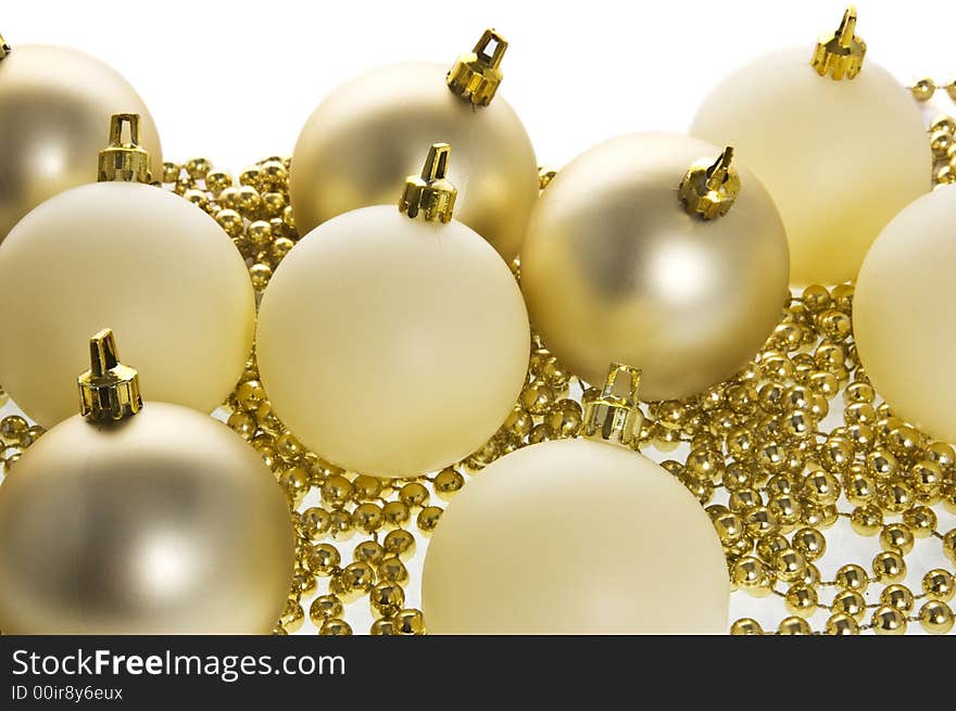 Complimentary golden & cream coloured christmas decorations. Complimentary golden & cream coloured christmas decorations