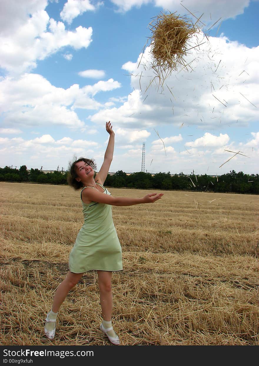 Young woman in yellow field with hay. Young woman in yellow field with hay