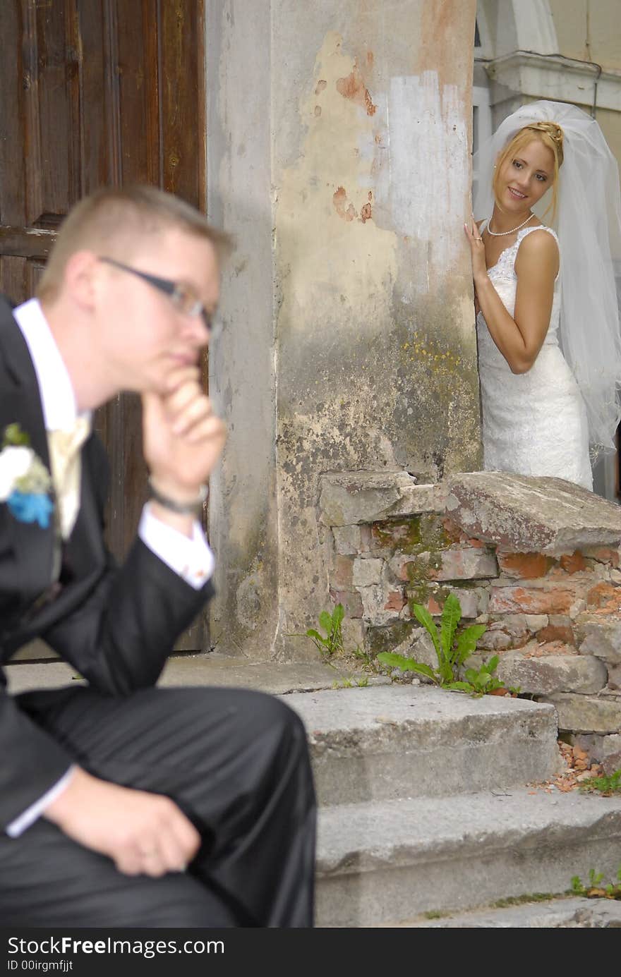 Bride looking at groom, goom unfocused