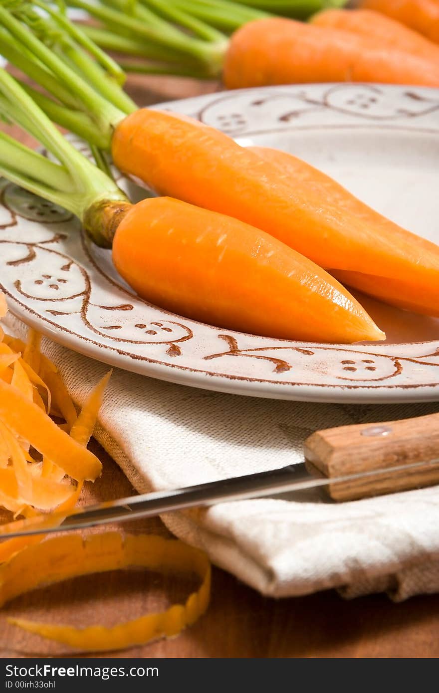 Fresh carrots on the grey plate