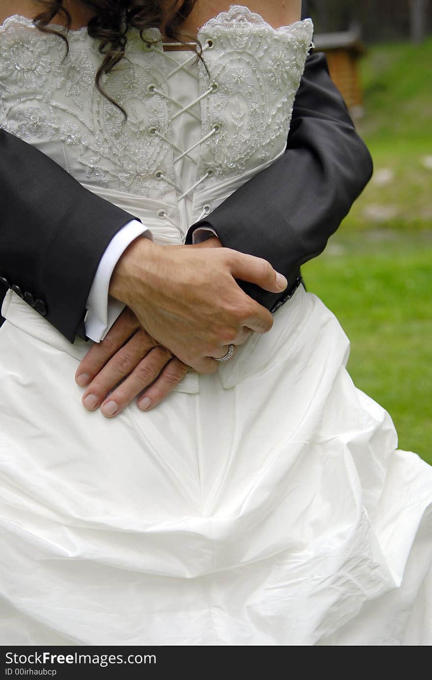 Groom embrace his bride