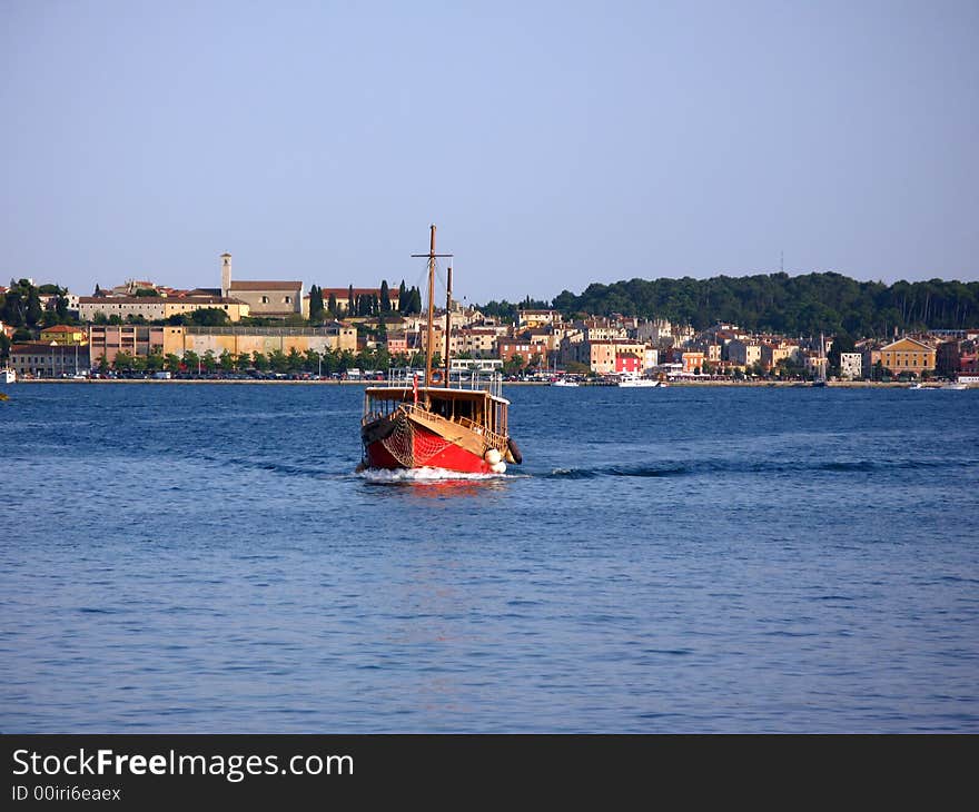 Old wooden ship  in the small harbor