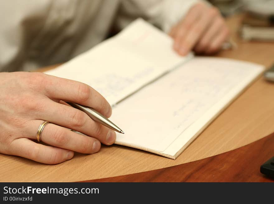 Notebook and man s hand