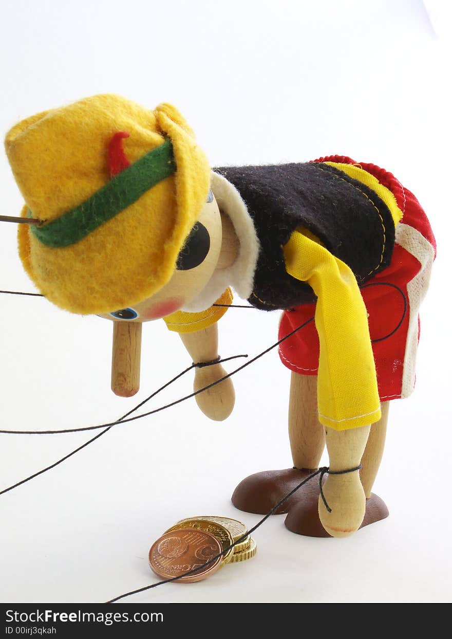 Wooden puppet raises coins