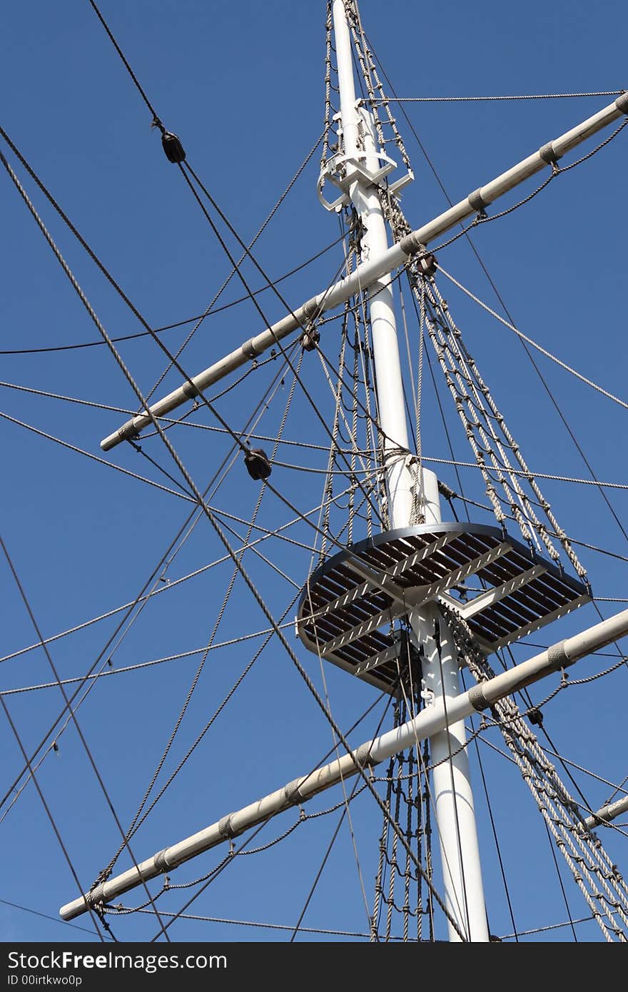 Mast of ship on blue sky background