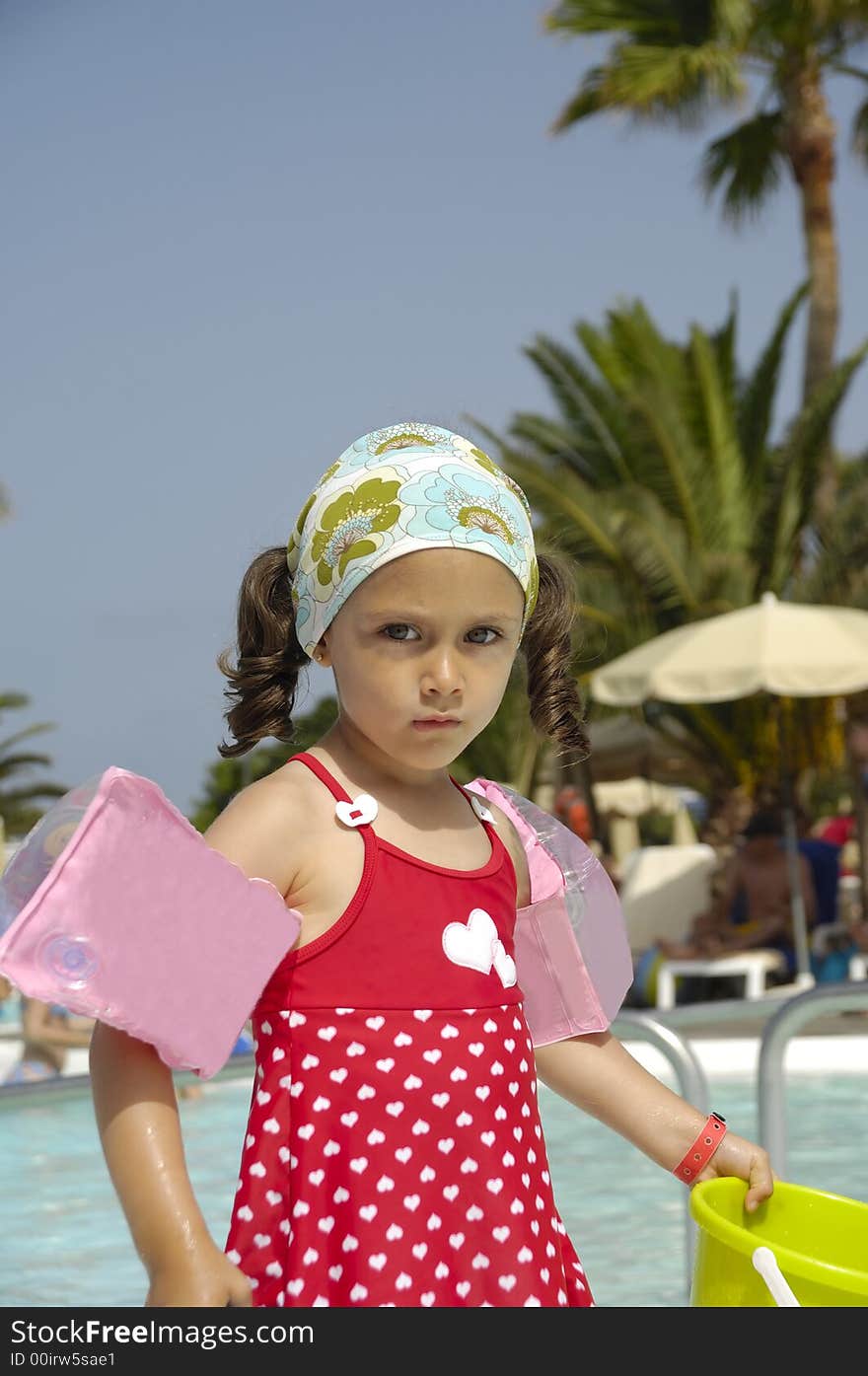 Portrait of a child playing by the pool. Portrait of a child playing by the pool