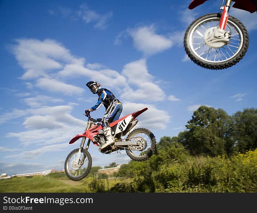 The motocross riders in the air. The motocross riders in the air