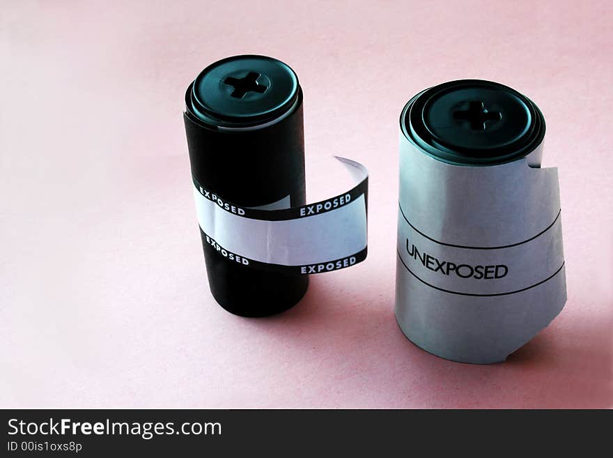 Two filmrolls, exposed and unexposed, for Hasselblad camera. With copy space. Two filmrolls, exposed and unexposed, for Hasselblad camera. With copy space.