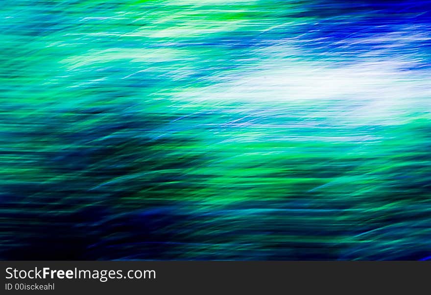 An abstract image created by using a slow shutter speed while moving and/or adjusting the focal length of the lens. Colors added and/or adjusted afterwards. An abstract image created by using a slow shutter speed while moving and/or adjusting the focal length of the lens. Colors added and/or adjusted afterwards.