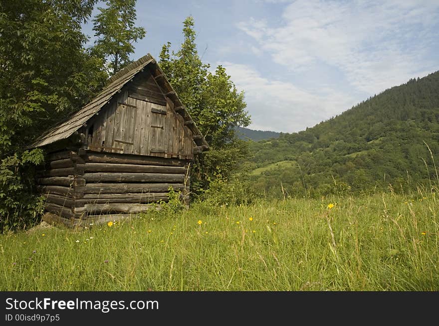 Wooden house for storing hay during winter in the slovak countryside.